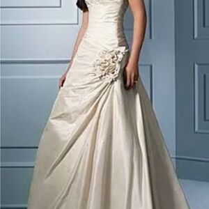 A. ANGELO. Used. My first dress, size 8. Retails for 700.00. Already cleaned.